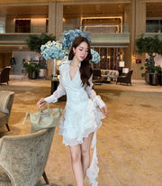 Wrap-style layered ruffle mini dress with sheer long sleeves and side tie